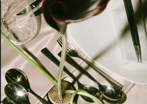 Elegant table setting with silverware and decorative elements